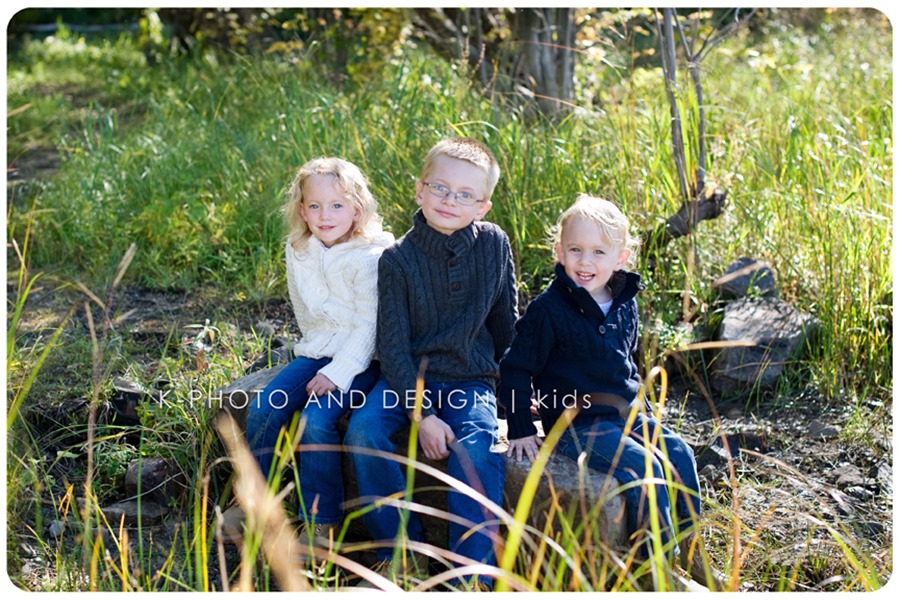 3 kids on a rock